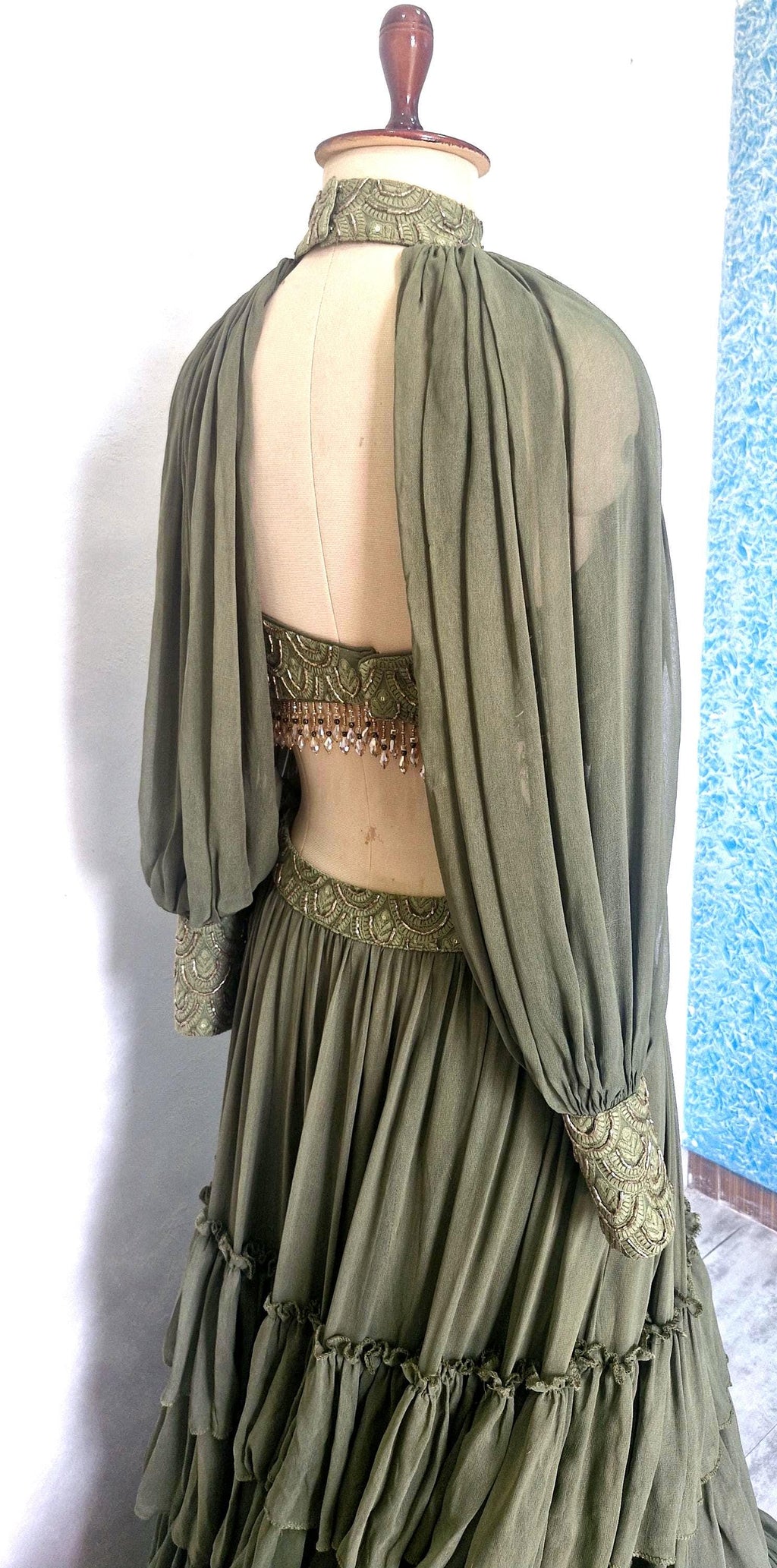 Olive Green Georgette Tiered Lehenga Choli. Embroidered Blouse, Bishop Sleeves. Mehendi Outfit DVMTD_0298